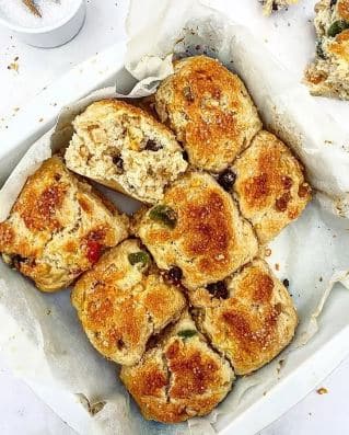 Christmas buns with orange, dried fruit, and cocktail cherries
